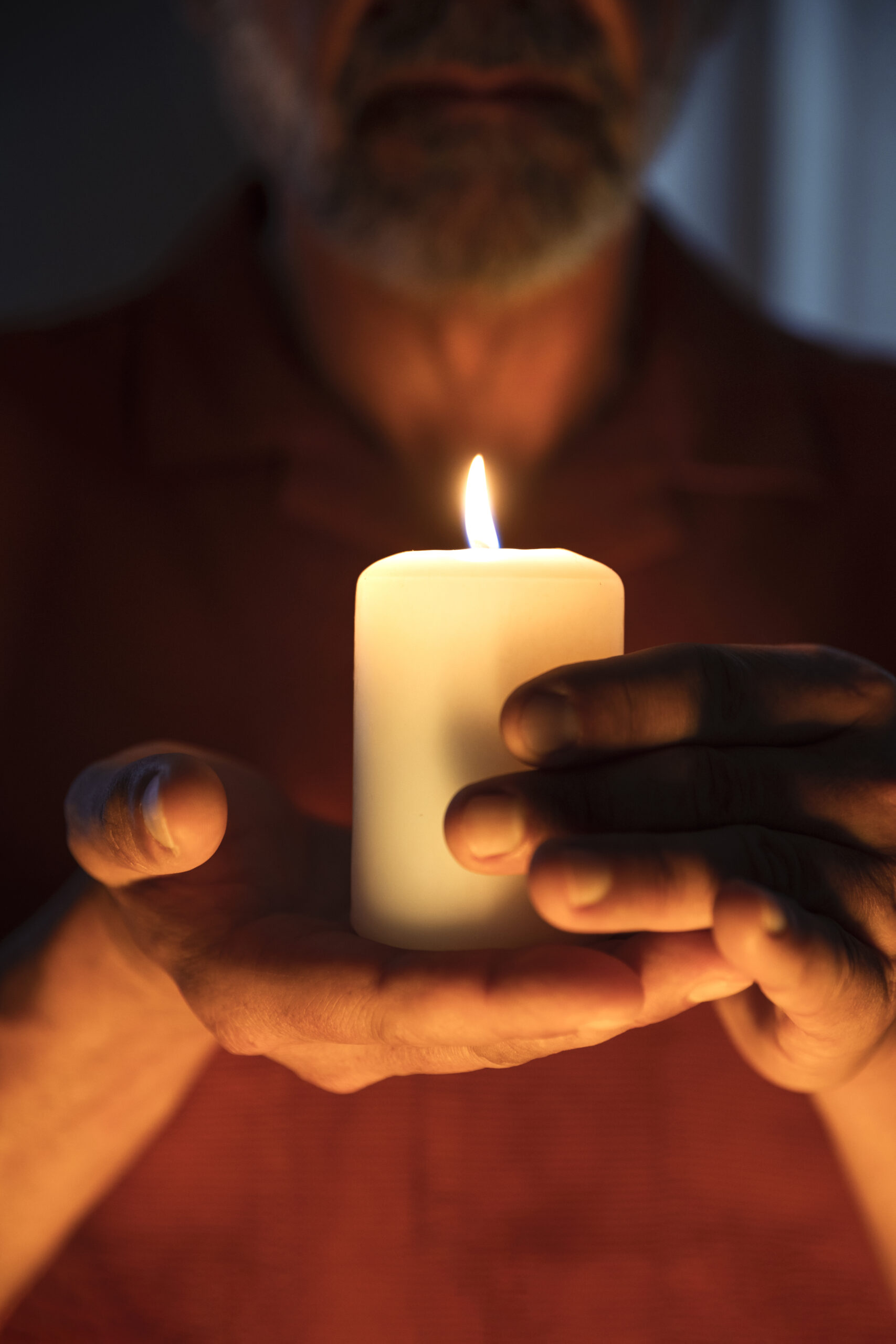 front-view-senior-man-holding-candle